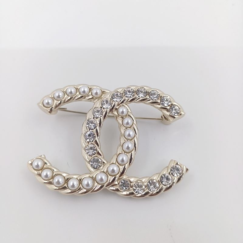 Ch*el brooches